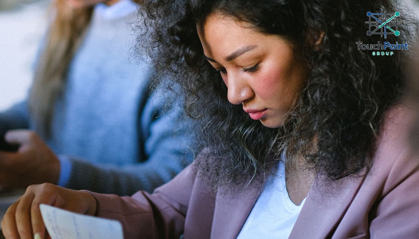 Illustrative professional reviewing paperwork after a career transition